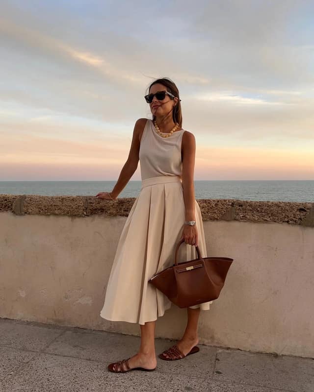 Cream Pleated Midi Skirt Outfit with Brown Leather Bag