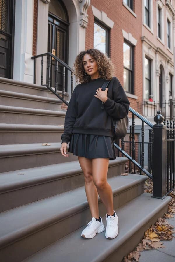 Black Sweatshirt Tennis Skirt Outfit with White Sneakers