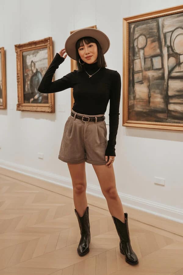 Taupe Pleated Shorts Outfit with Black Turtleneck and Boots