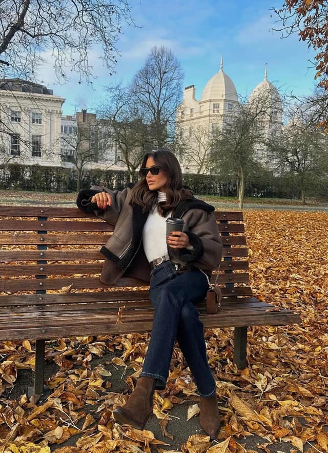 Brown Shearling Jacket Outfit with White Turtleneck and Jeans