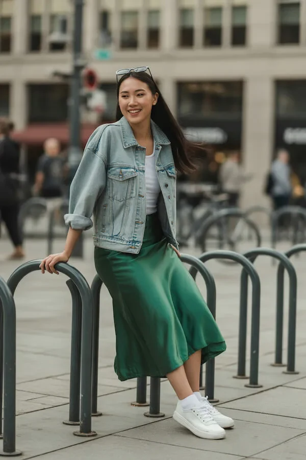 Light Wash Denim Jacket with Green Slip Skirt and White Sneakers