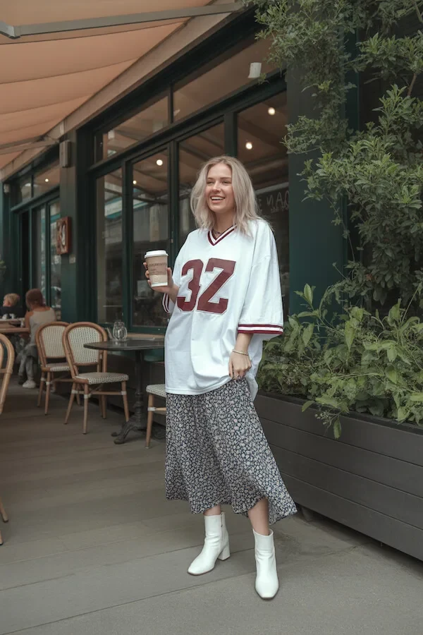 White Varsity Jersey with Floral Midi Skirt and White Ankle Boots