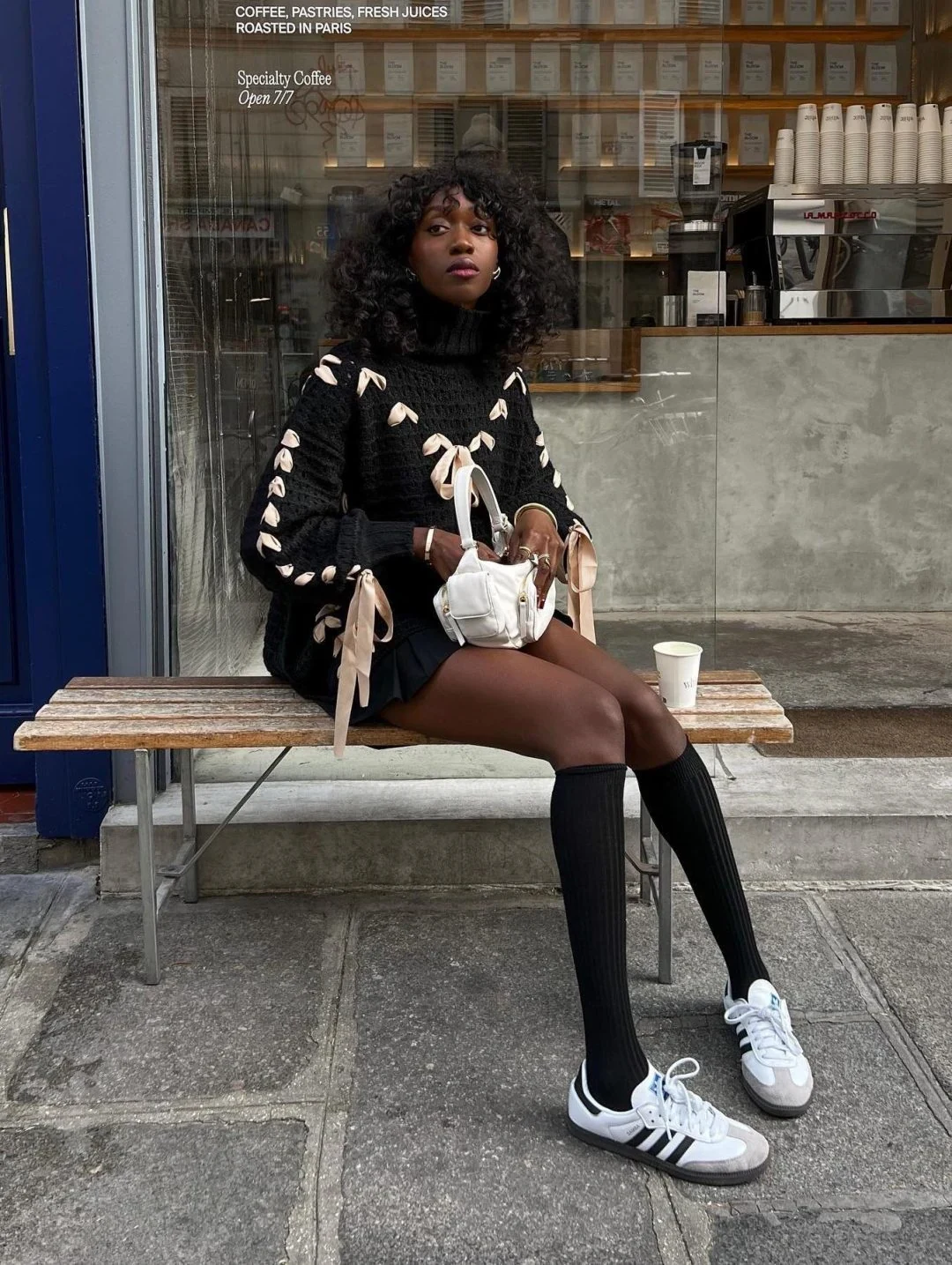 Black Cable Knit Sweater Outfit with Bow Sleeves and Mini Skirt