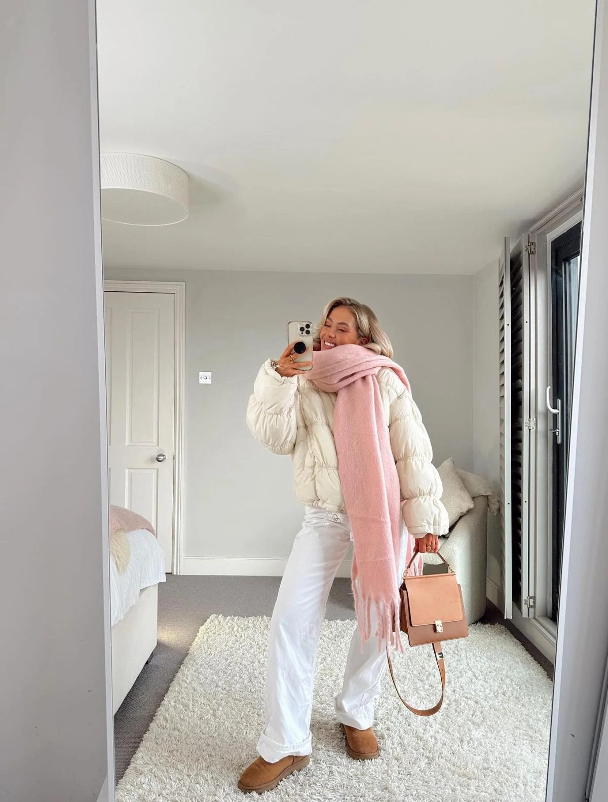 Cream Puffer Jacket Outfit with Pink Scarf and White Jeans