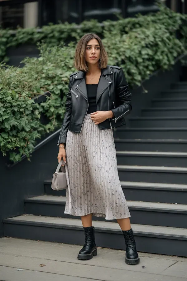Black Leather Moto Jacket with Floral Pleated Midi Skirt and Combat Boots