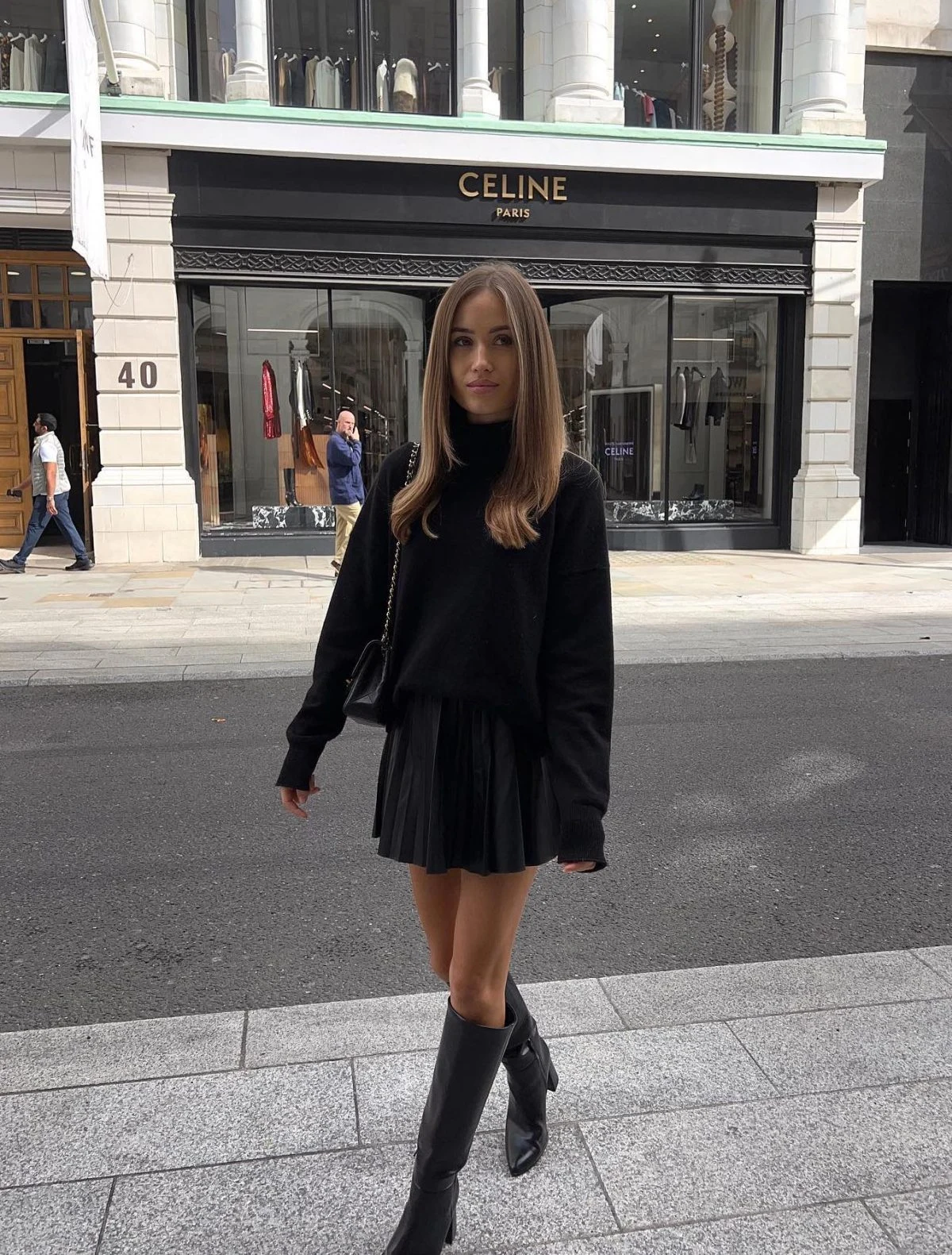 Black Turtleneck Pleated Skirt Outfit with Knee-High Boots