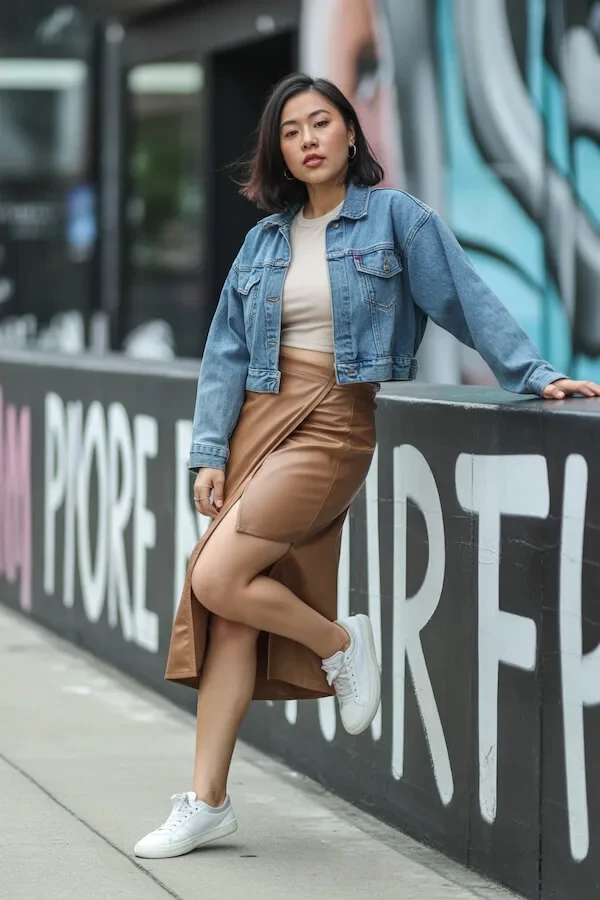 Denim Jacket Camel Leather Skirt Outfit with White Sneakers