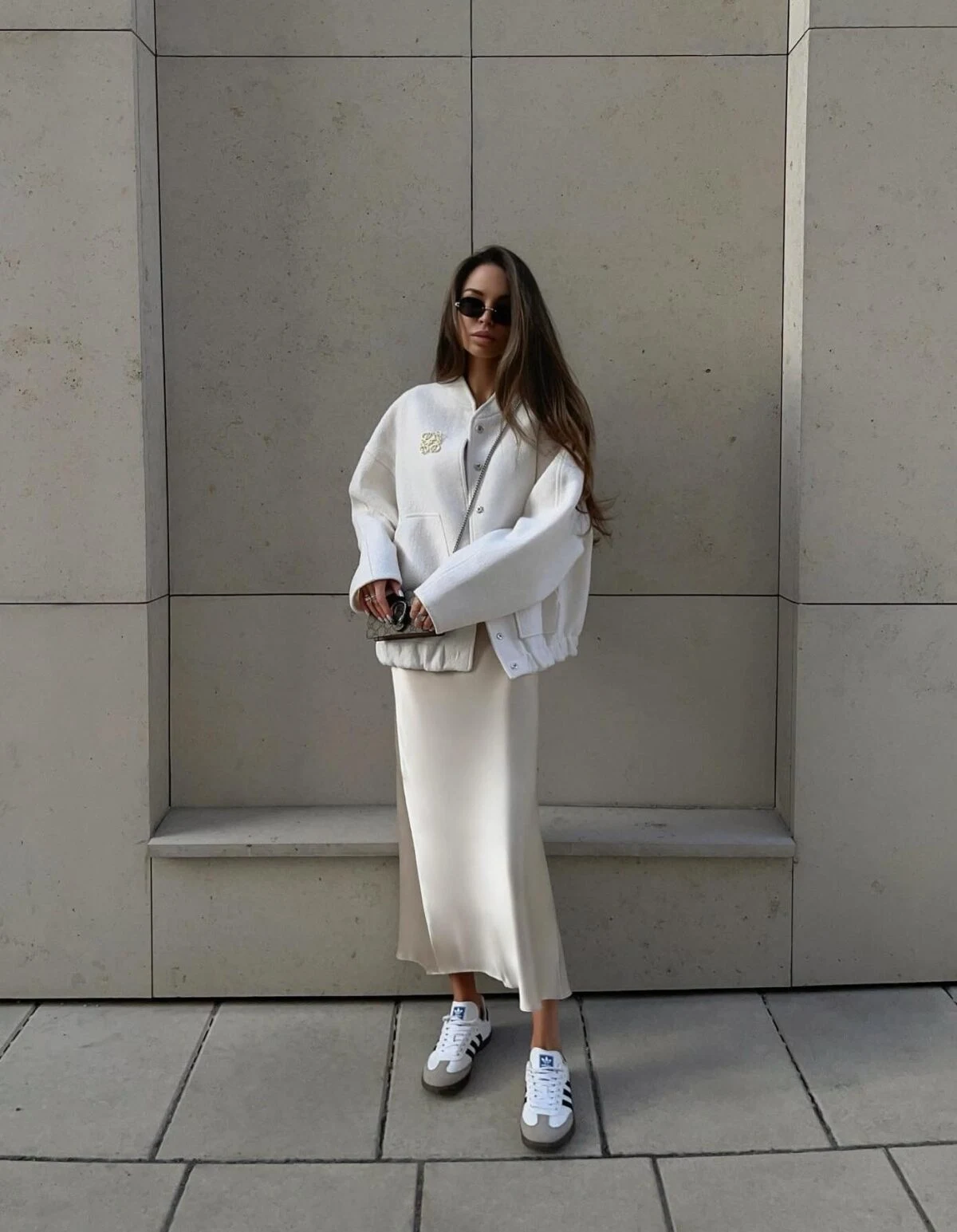 White Varsity Jacket Outfit with Cream Silk Skirt