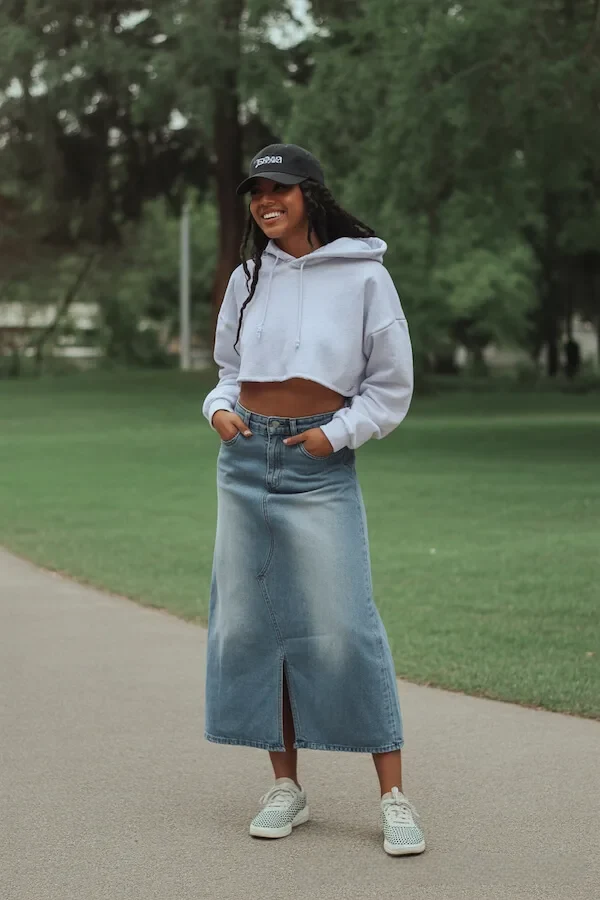 White Cropped Hoodie with Denim Maxi Skirt and Baseball Cap