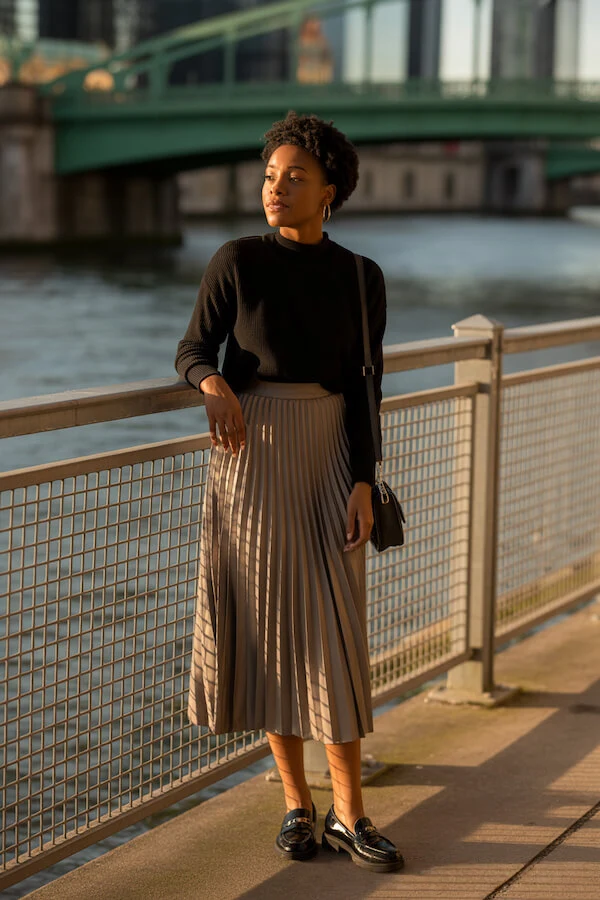 Black Knit Sweater and Beige Pleated Midi Skirt with Loafers
