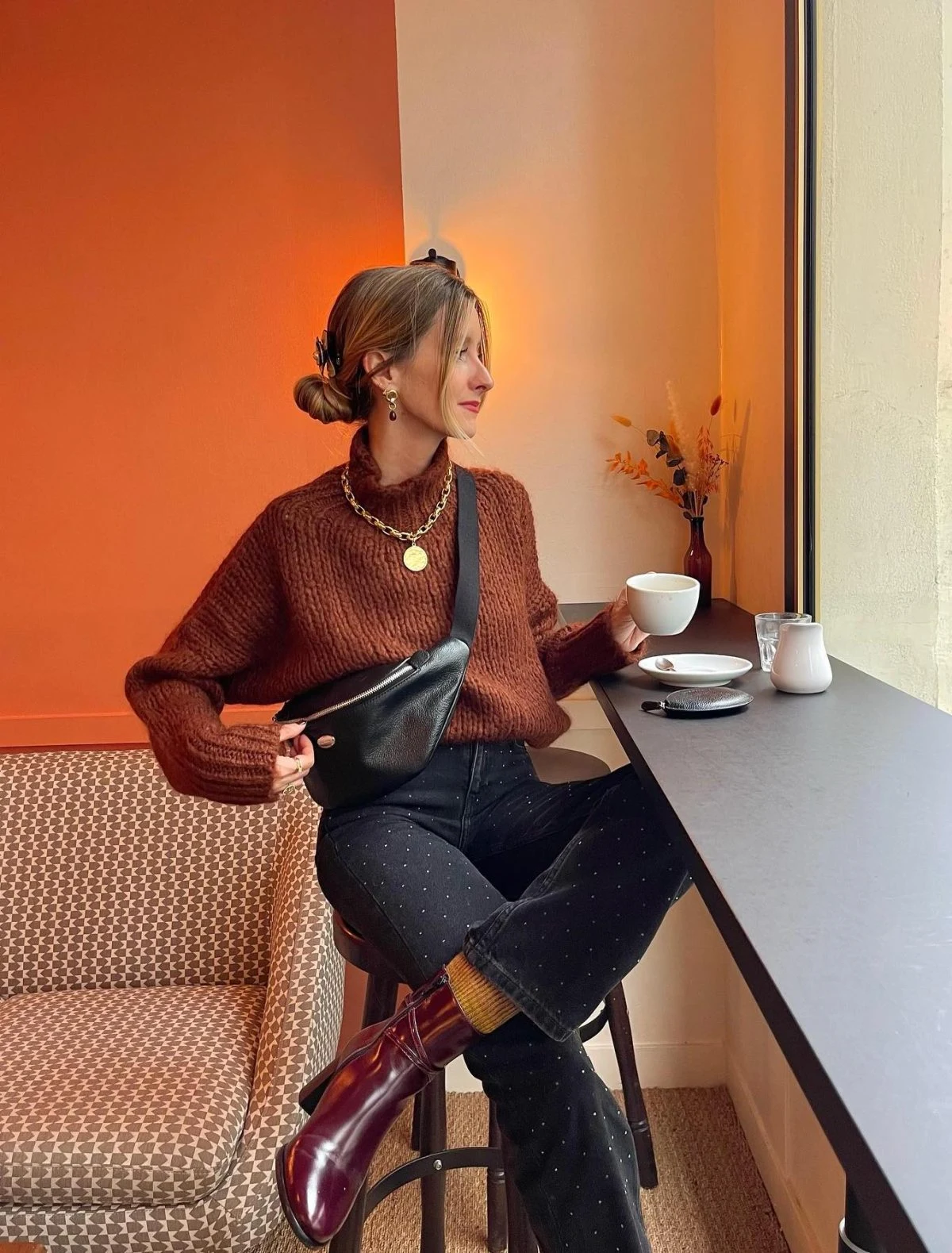 Rust Sweater Outfit with Black Studded Jeans and Burgundy Boots
