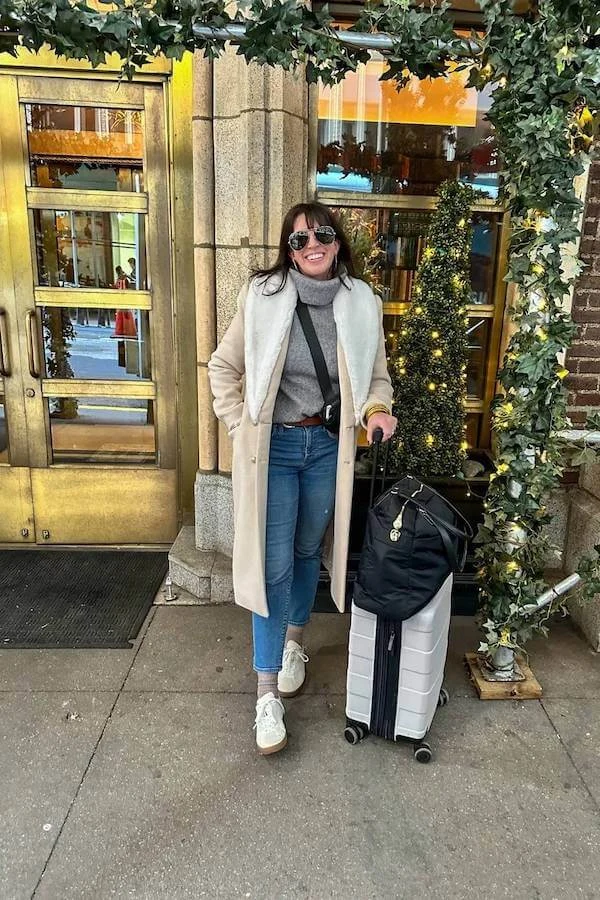 Cream Coat Grey Turtleneck Jeans Airport Outfit