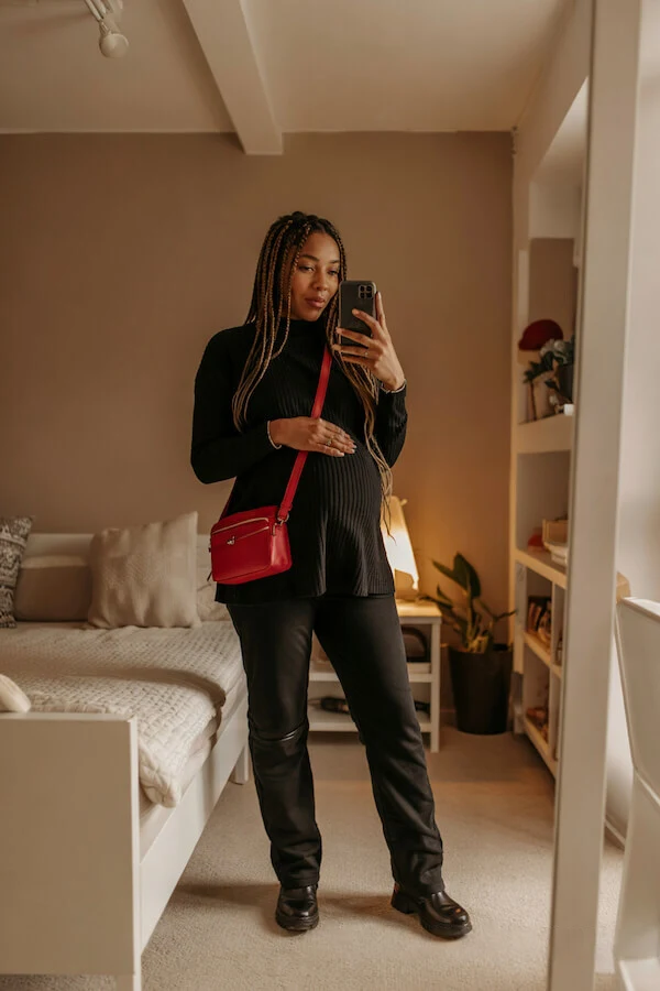 Black Turtleneck Sweater Outfit with Leather Trousers and Red Bag