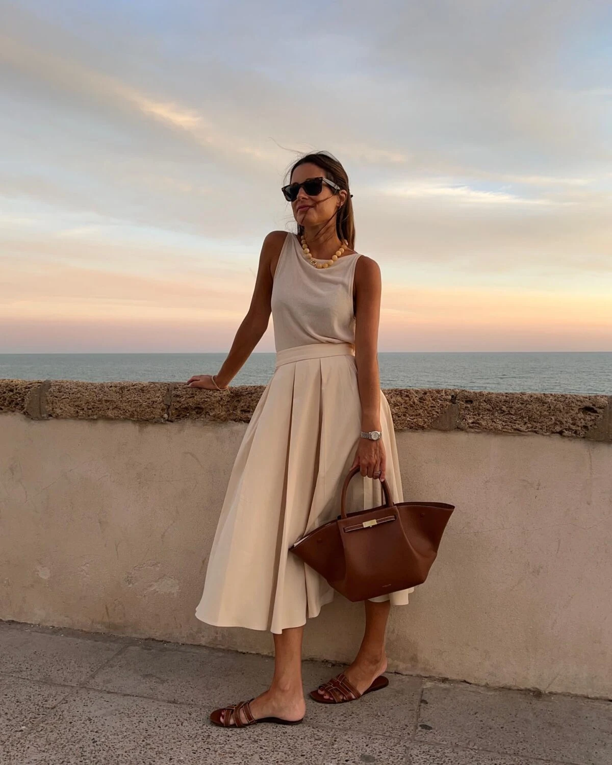 Cream Pleated Midi Skirt Outfit with Brown Leather Bag