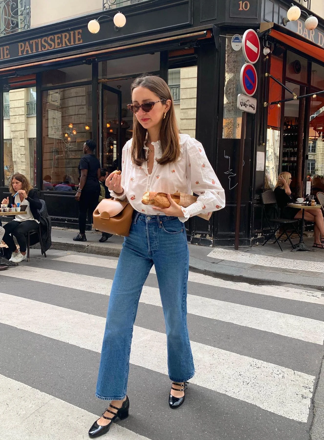 White Embroidered Blouse Outfit with Flare Jeans and Mary-Jane Heels