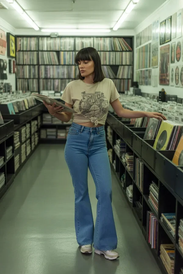 Graphic Tee Knot with High-Waisted Flared Jeans Record Store Outfit