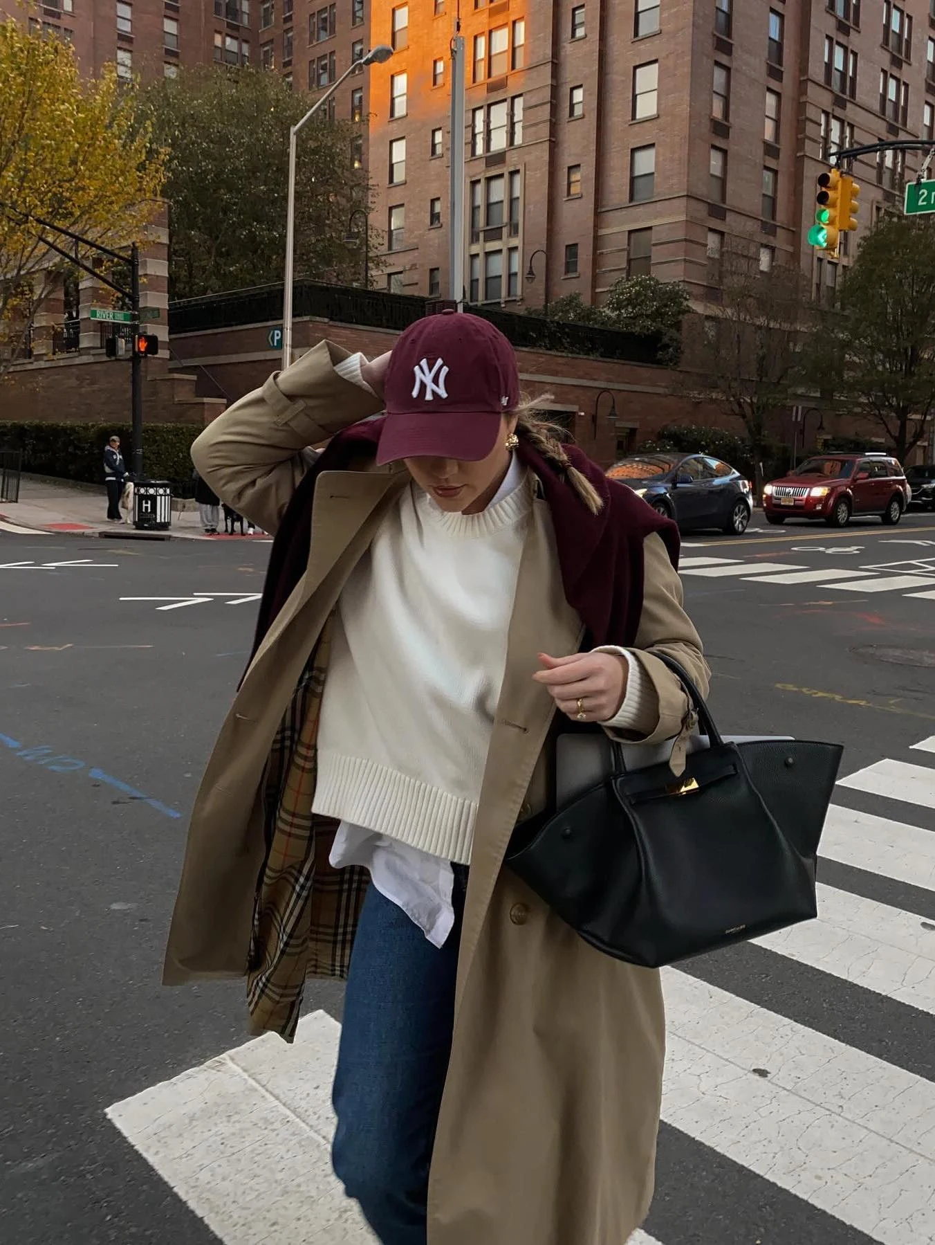 Camel Trench Coat Outfit with Cream Sweater and Dark Jeans
