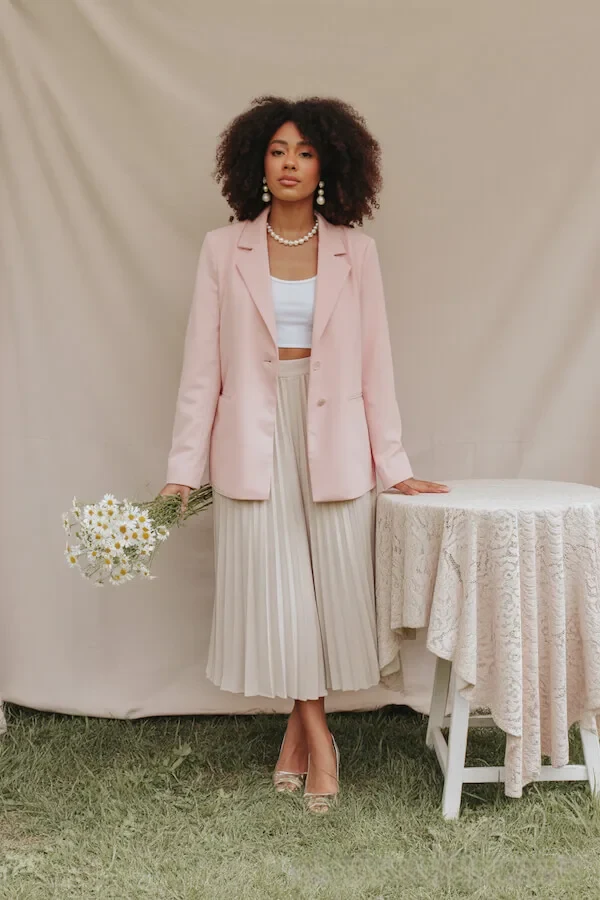 Blush Pink Blazer with Cream Pleated Midi Skirt and Pearl Accessories