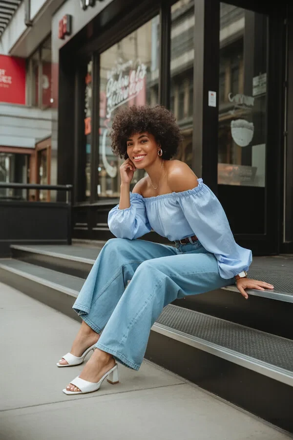 Light Blue Off-Shoulder Top with Wide-Leg Denim and White Mules