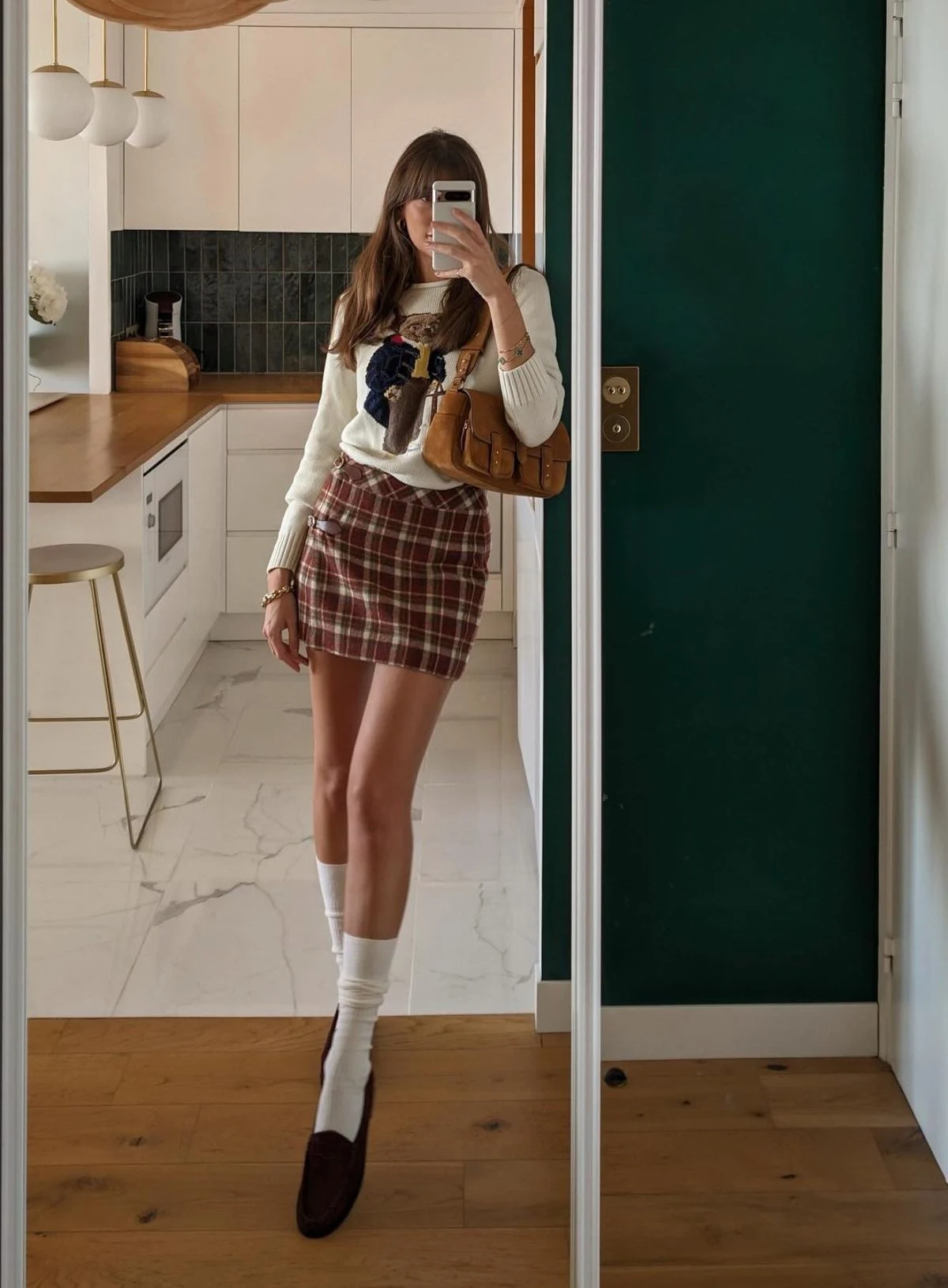 Plaid Mini Skirt Outfit with Graphic Sweater and Knee Socks