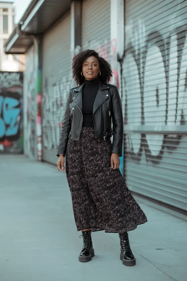 Black Leather Biker Jacket with Floral Midi Skirt and Combat Boots