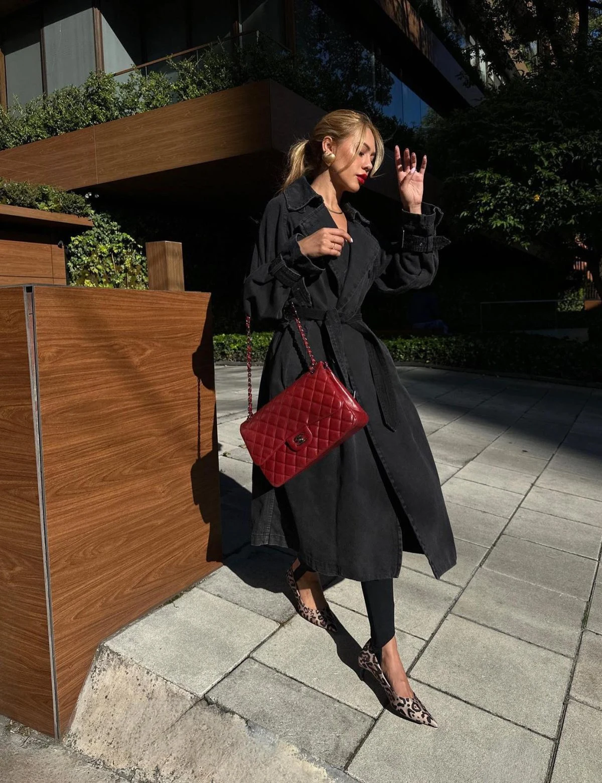Black Trench Coat Outfit with Red Bag and Leopard Flats