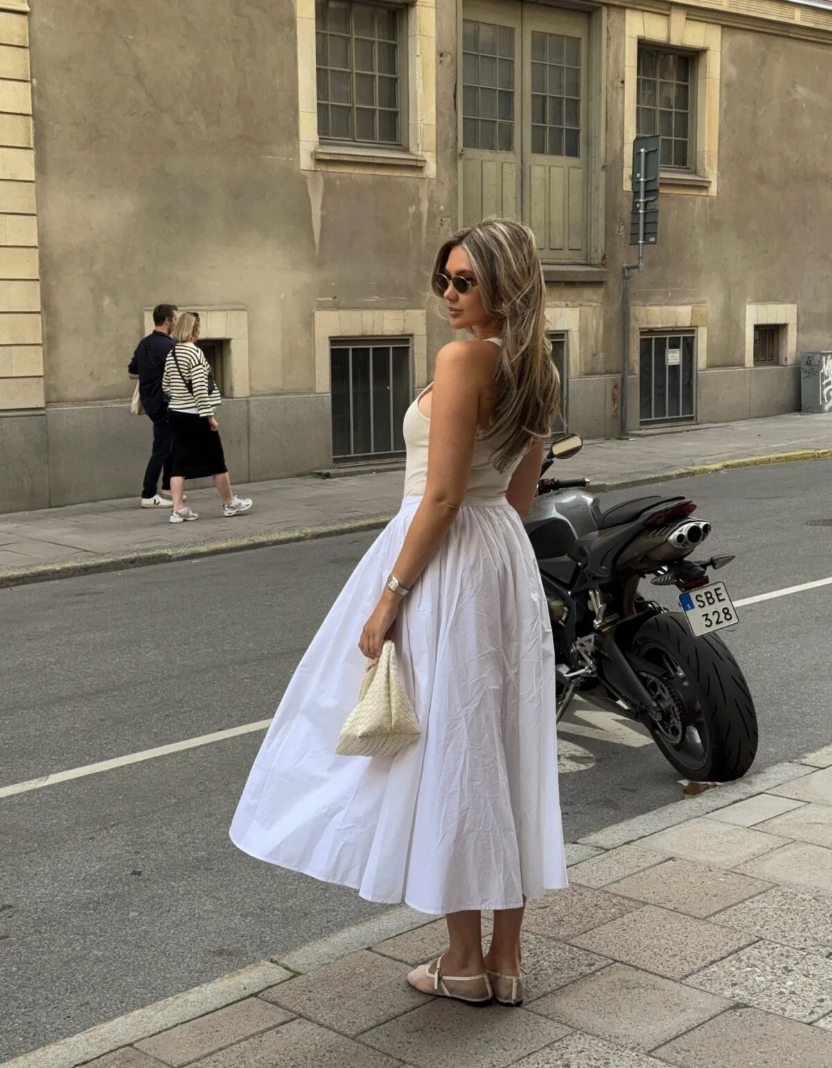 White Strapless Midi Dress Outfit with Woven Clutch