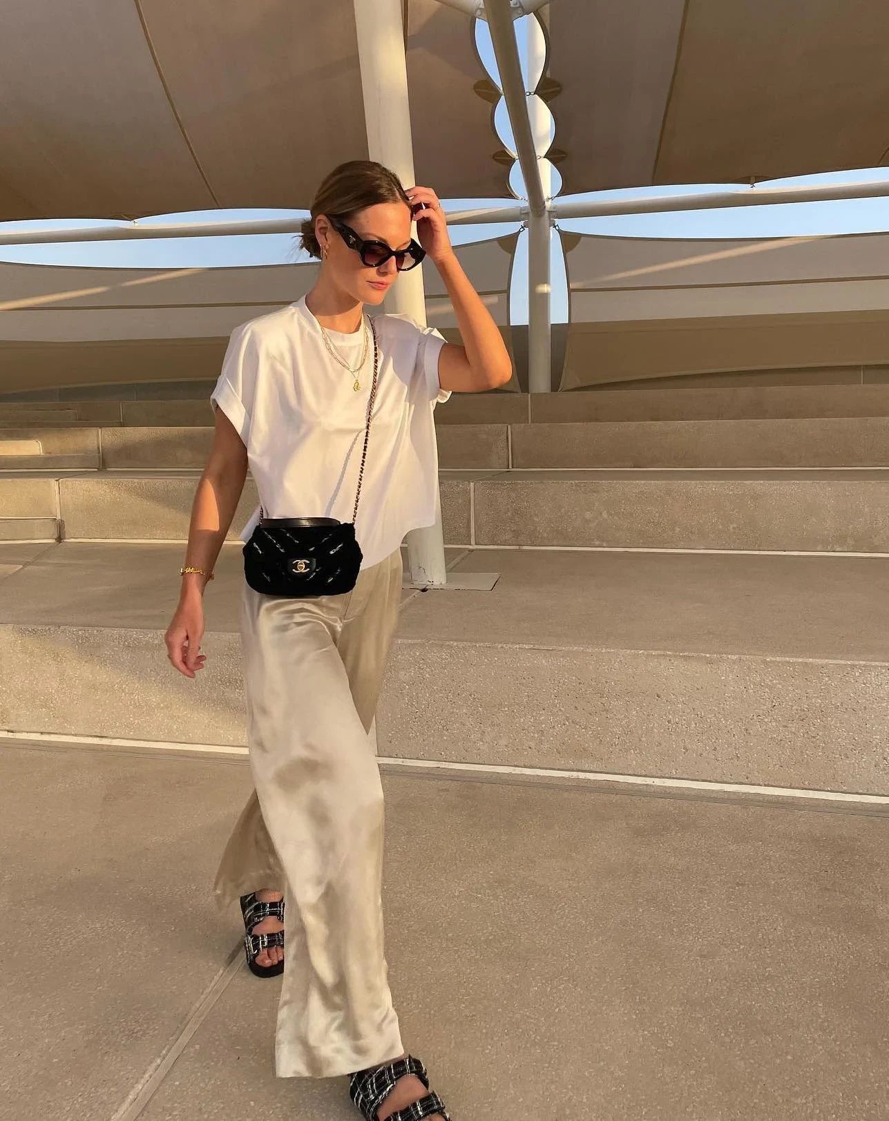White T-Shirt Cream Wide-Leg Trousers Black Quilted Bag