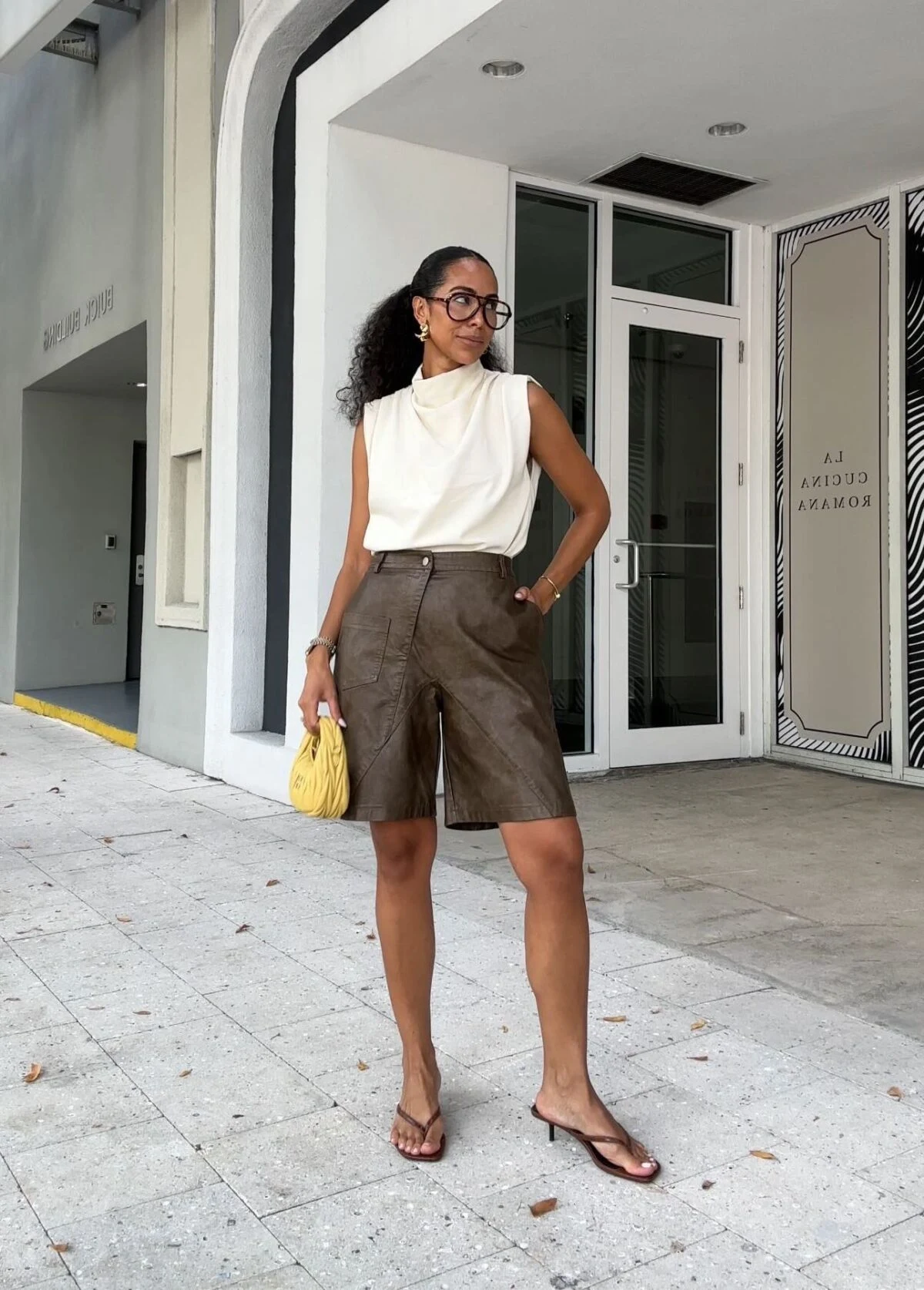Cream Sleeveless Turtleneck Olive Cargo Bermuda Shorts Outfit