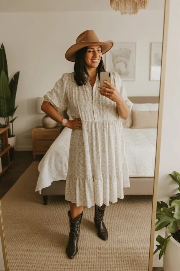 Cream Tiered Midi Dress with Black Cowboy Boots and Tan Wide-Brim Hat