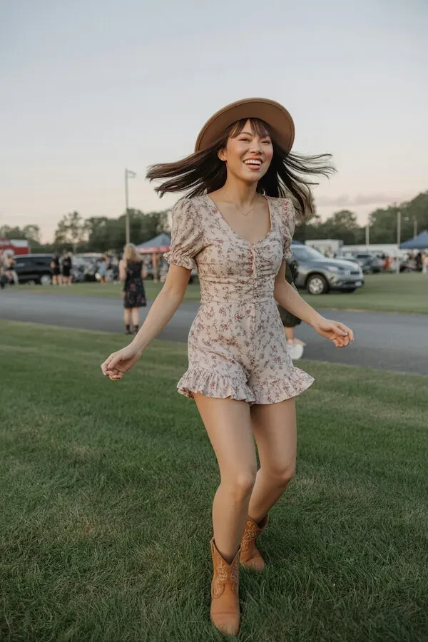 Floral Ruffle Mini Dress with Tan Ankle Boots and Wide-Brim Hat