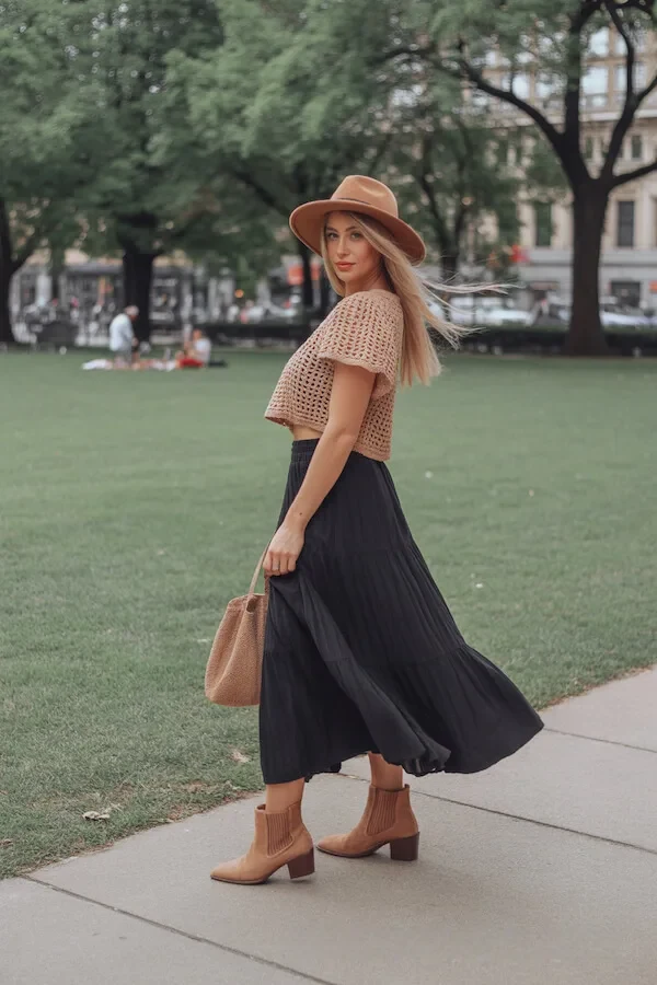 Beige Crochet Crop Top with Black Pleated Midi Skirt and Tan Ankle Boots