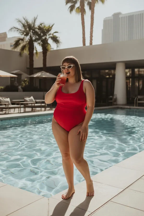 Red One-Piece Swimsuit Poolside Outfit with Cat-Eye Sunglasses