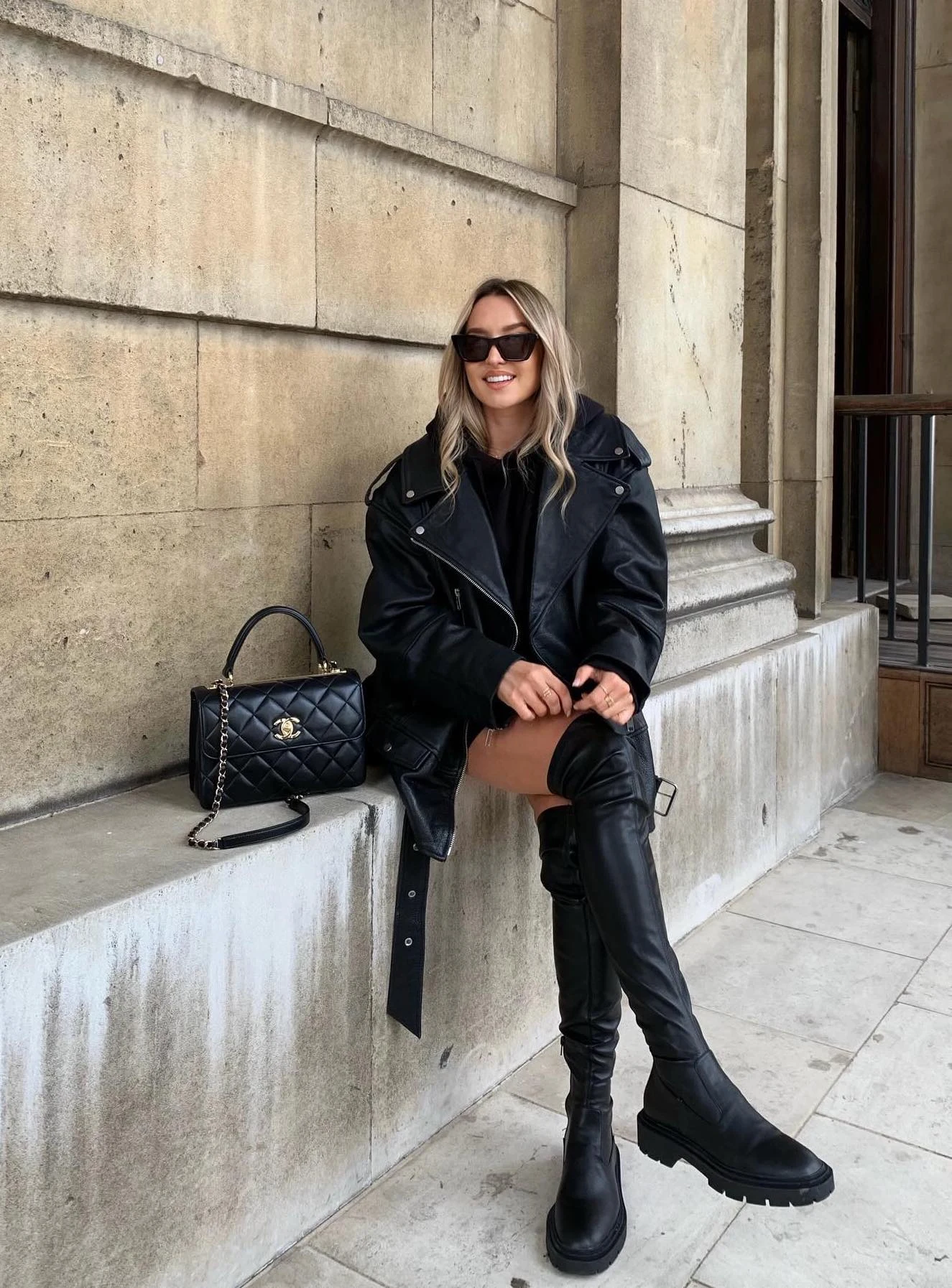 Black Leather Trench Coat Outfit with Knee-High Boots
