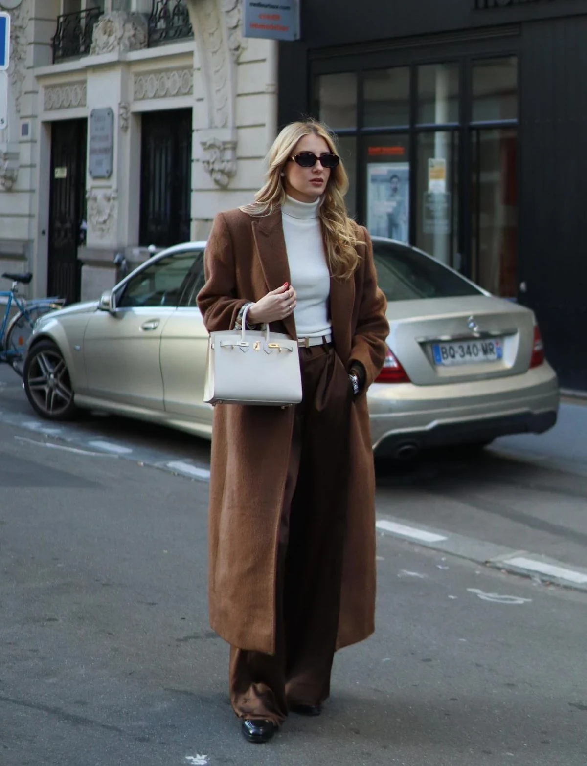 Brown Suit Cream Turtleneck Outfit with White Bag